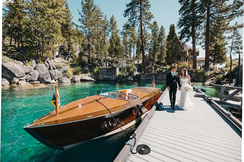 Slide: The Image of 2007 Hacker-Craft 32 Sportabout docked by a couple in wedding attire, scenic forest backdrop. - 17