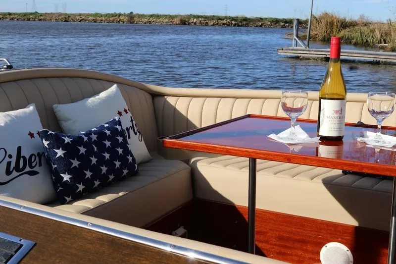 Slide: The Image of Luxurious 2007 Hacker-Craft 32 Sportabout boat interior with wine and patriotic pillows. - 19