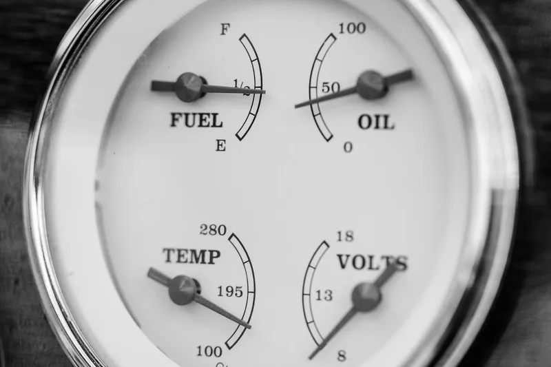 Slide: The Image of Close-up of a 2007 Hacker-Craft 32 Sportabout gauge panel showing fuel, oil, temperature, and voltage. - 25