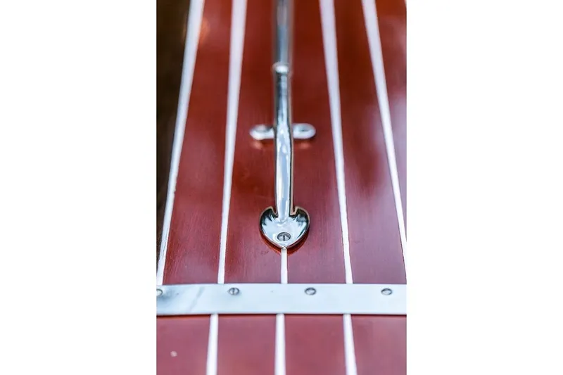 Slide: The Image of Close-up of 2007 Hacker-Craft 32 Sportabout's polished wood deck with chrome details. - 28