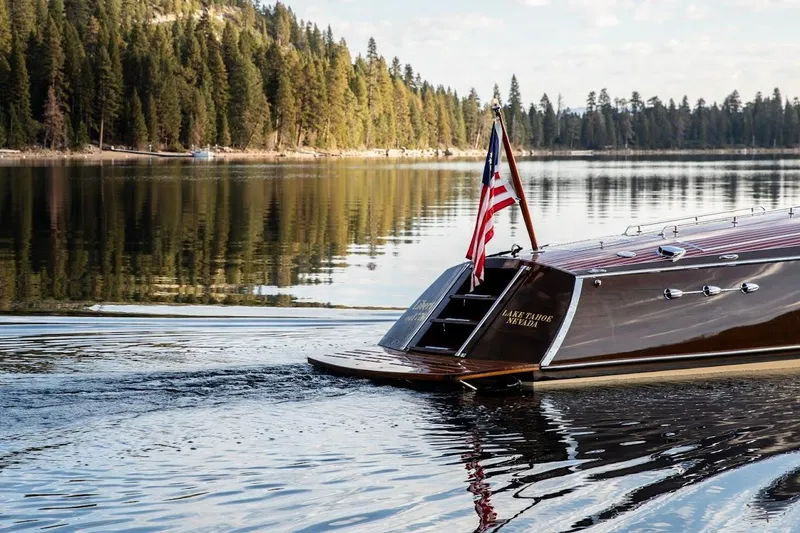 Slide: The Image of 2007 Hacker-Craft 32 Sportabout boat on Lake Tahoe, Nevada, with American flag. - 3