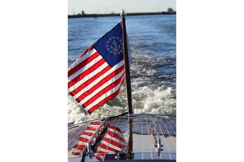 Slide: The Image of Hacker-Craft 32 Sportabout 2007 with American flag on water. - 40
