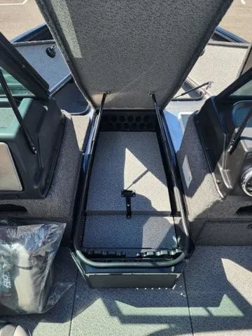 Slide: The Image of Lund 1875 Impact XS Sport 2026, open storage compartment in boat. - 5