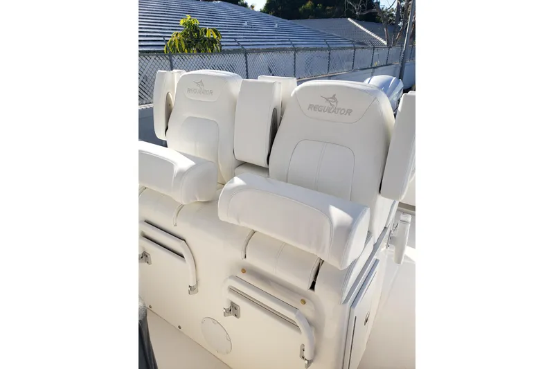 Slide: The Image of 2022 Regulator 31 boat seats with white upholstery and logo embroidery. - 14
