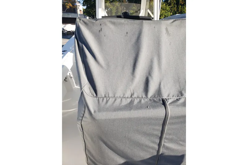 Slide: The Image of Gray cover on a 2022 Regulator 31 boat, partially shaded. - 22