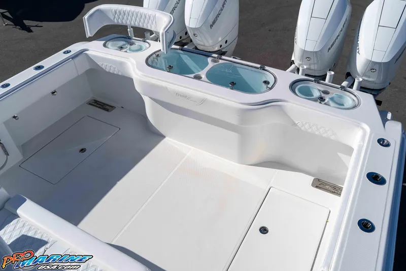 Slide: The Image of 2026 Front Runner 43 Catamaran deck with seating and Mercury outboard engines. - 13