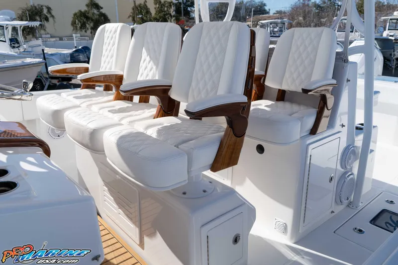 Slide: The Image of Luxurious seating on 2026 Front Runner 43 Catamaran, featuring elegant white upholstery and wooden accents. - 16