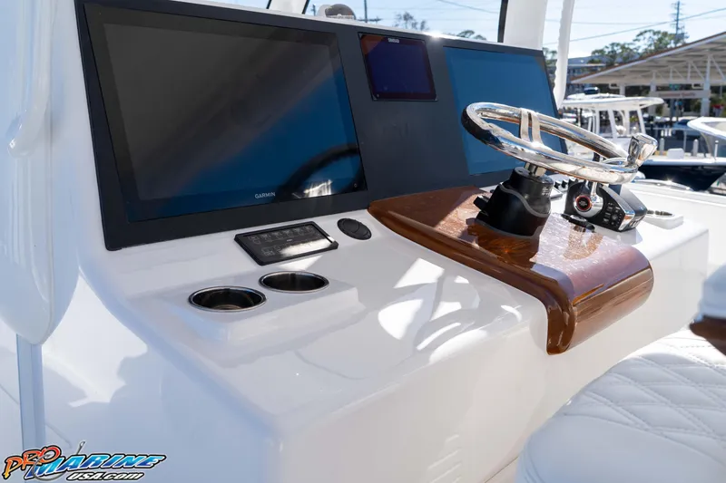 Slide: The Image of Helm of 2026 Front Runner 43 Catamaran with modern controls and displays. - 17