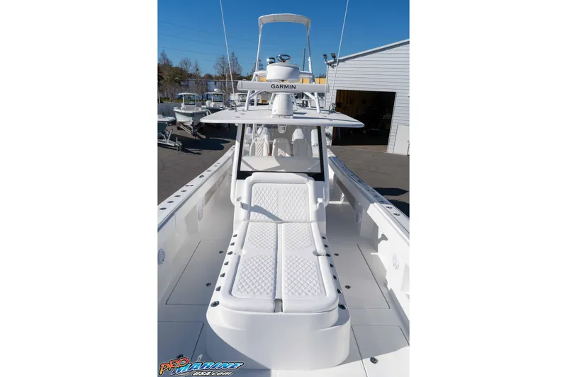 Slide: The Image of 2026 Front Runner 43 Catamaran with sleek white deck and advanced Garmin navigation. - 22