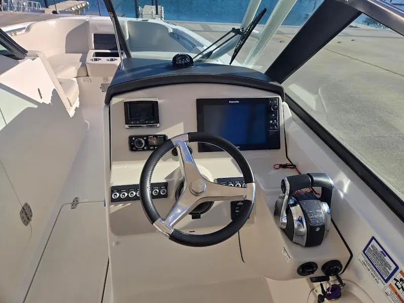 Slide: The Image of Helm of a 2018 Boston Whaler 270 Vantage boat. - 14