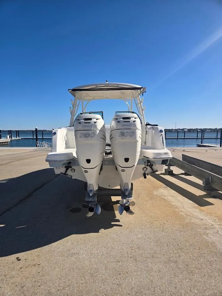 Slide: The Image of 2018 Boston Whaler 270 Vantage with twin outboard engines at dock. - 20