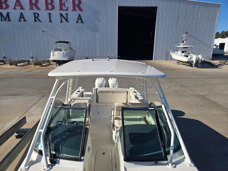 Slide: The Image of 2018 Boston Whaler 270 Vantage at a marina. - 3