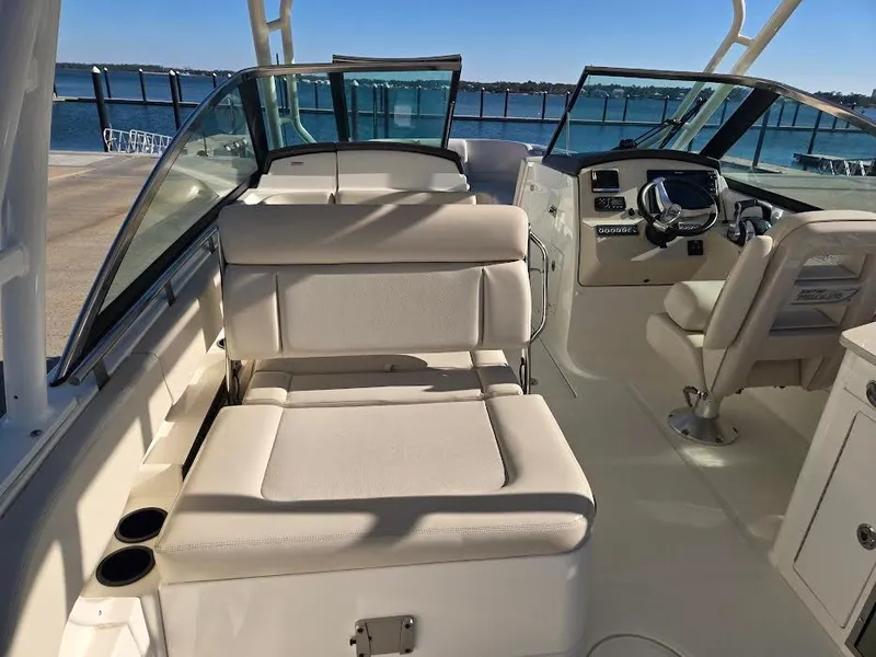 Slide: The Image of Interior of a 2018 Boston Whaler 270 Vantage boat by the water. - 4