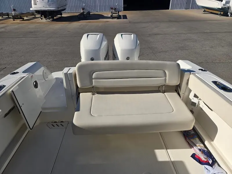 Slide: The Image of 2018 Boston Whaler 270 Vantage with dual engines and seating area. - 8