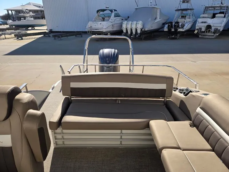 Slide: The Image of Interior of a 2021 Bennington LX24SBSD pontoon boat at the marina. - 10