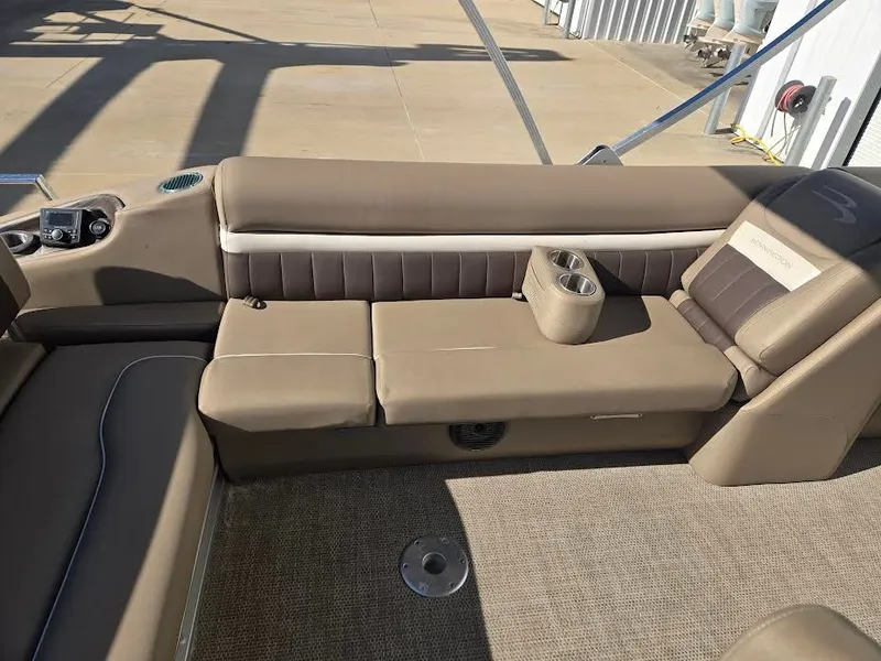 Slide: The Image of Interior of a 2021 Bennington LX24SBSD pontoon boat with beige seating. - 11