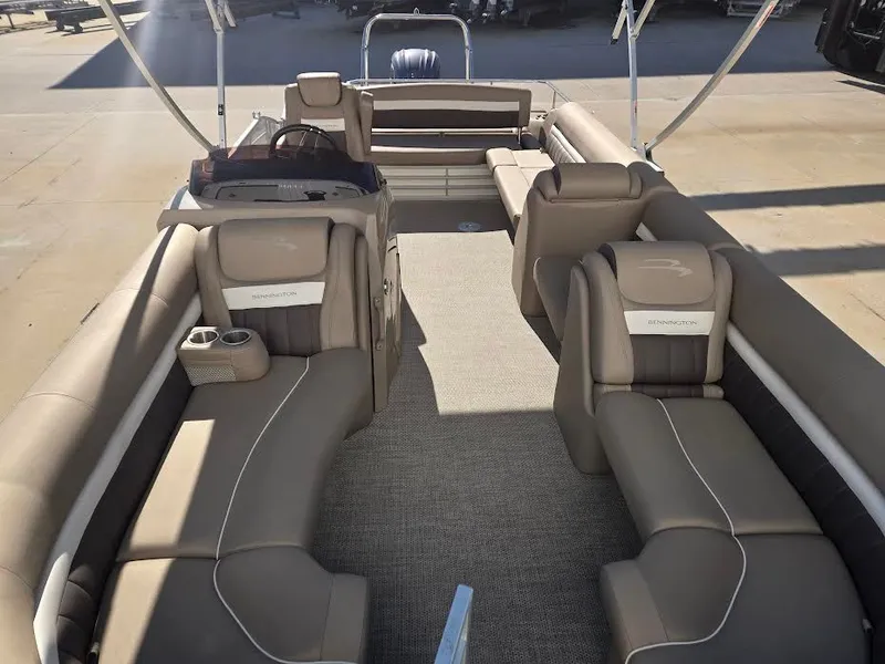 Slide: The Image of Interior of a 2021 Bennington LX24SBSD pontoon boat with beige seating. - 5
