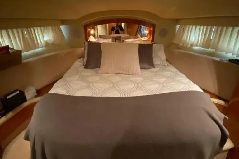 Slide: The Image of Luxurious bedroom interior of 2000 Sea Ray 400 Sedan Bridge yacht. - 14