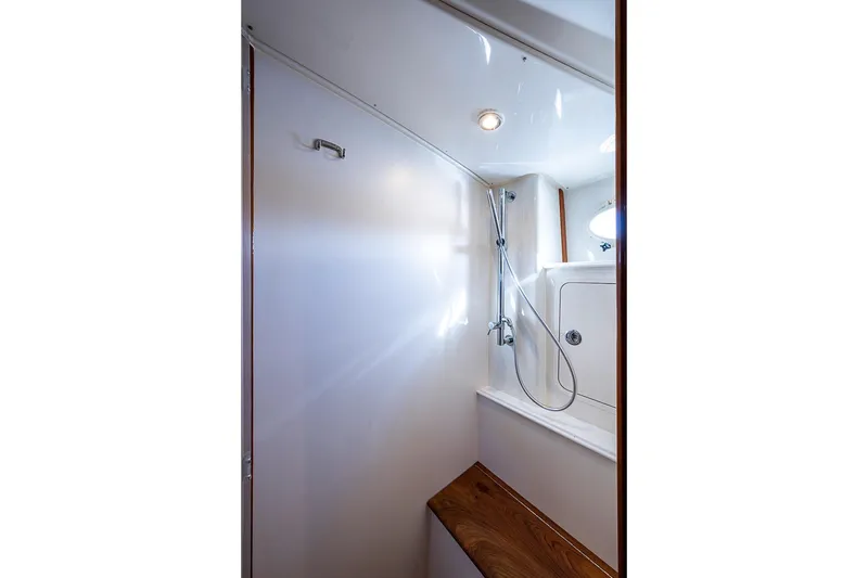 Slide: The Image of 2023 Hinckley Sport Boat 40 X bathroom with sleek shower design. - 31