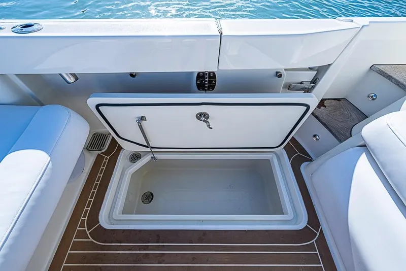 Slide: The Image of 2023 Hinckley Sport Boat 40 X open storage compartment on deck. - 10