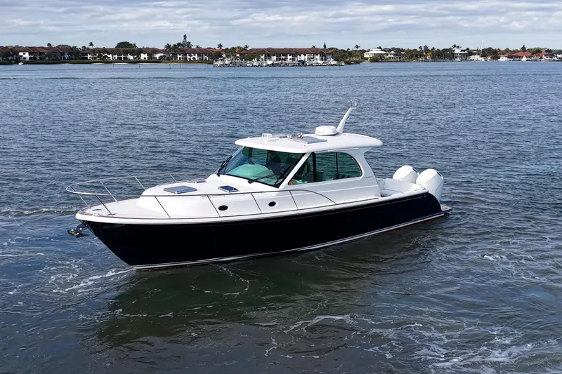 Slide: The Image of 2023 Hinckley Sport Boat 40 X cruising on calm waters. - 3