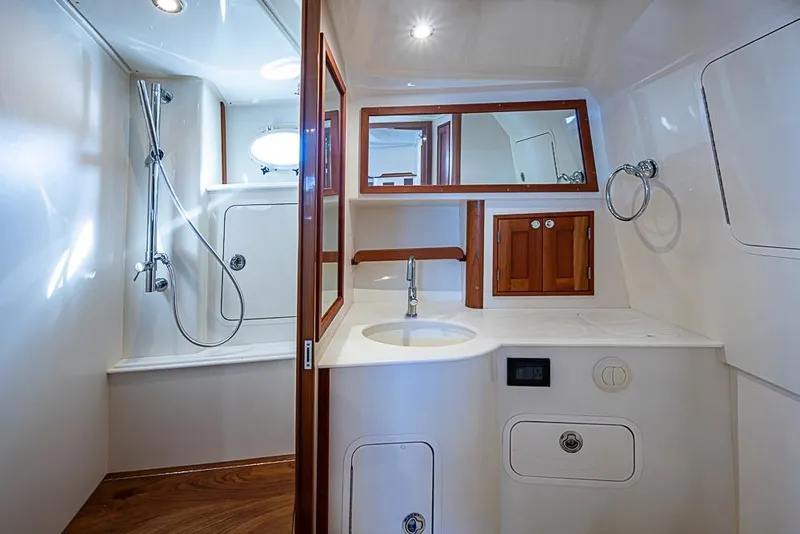 Slide: The Image of Luxurious bathroom interior of 2023 Hinckley Sport Boat 40 X with shower and sink. - 30