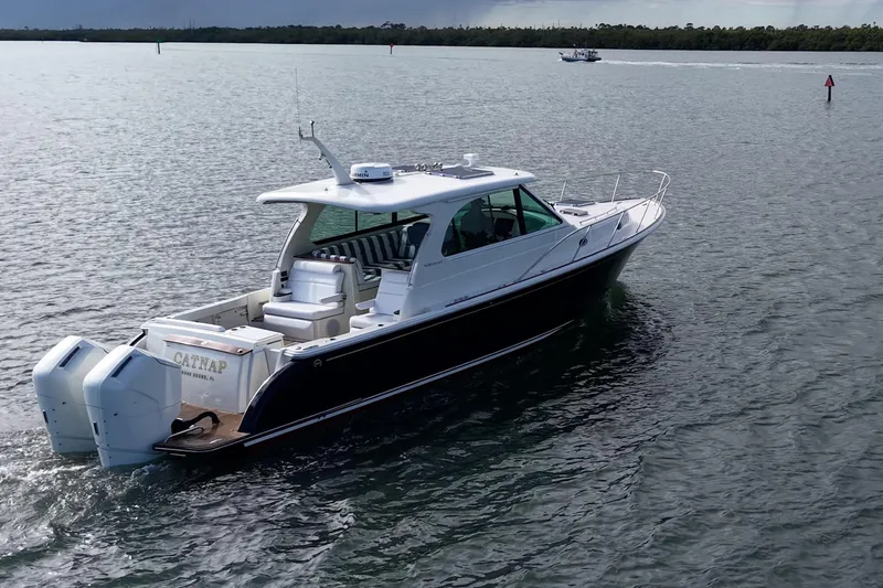 Slide: The Image of 2023 Hinckley Sport Boat 40 X cruising on calm waters. - 41