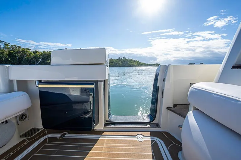 Slide: The Image of Hinckley Sport Boat 40 X 2023 interior with open door, scenic water view. - 8