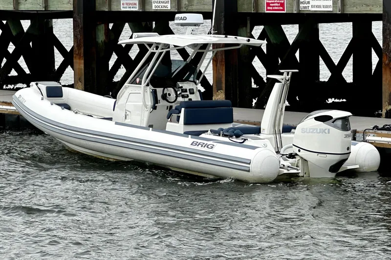 The Image of 2022 Brig Eagle 8 boat docked with Suzuki engine, featuring sleek design and modern amenities. - 1