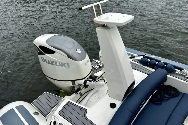 Slide: The Image of 2022 Brig Eagle 8 boat with Suzuki outboard motor on water. - 16