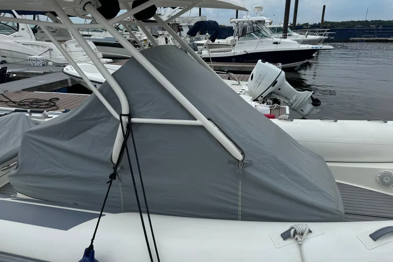 Slide: The Image of 2022 Brig Eagle 8 boat with cover, docked at marina. - 23