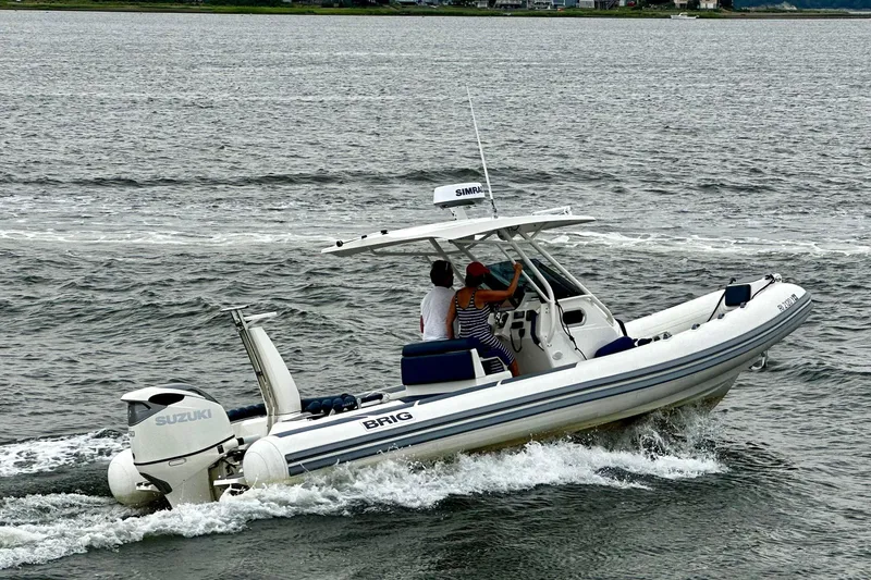 Slide: The Image of 2022 Brig Eagle 8 boat cruising on water with Suzuki engine. - 4