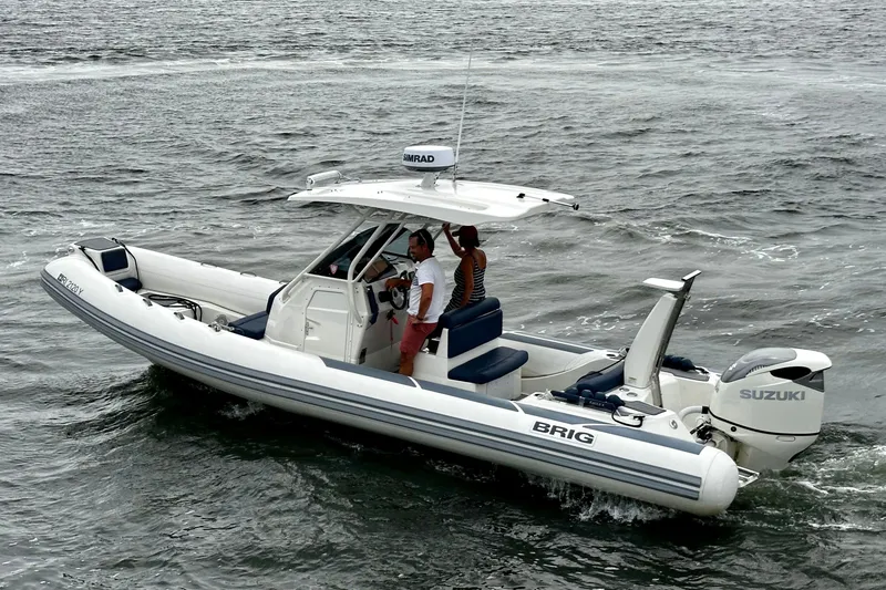Slide: The Image of 2022 Brig Eagle 8 boat cruising on water with Suzuki outboard engine. - 5