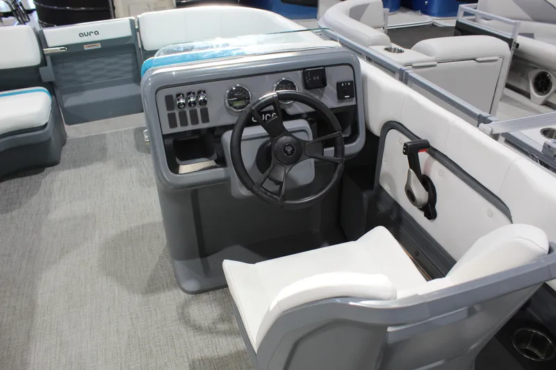 Slide: The Image of 2025 Avalon 2185 25 AURA QL boat interior with steering wheel and seating. - 3