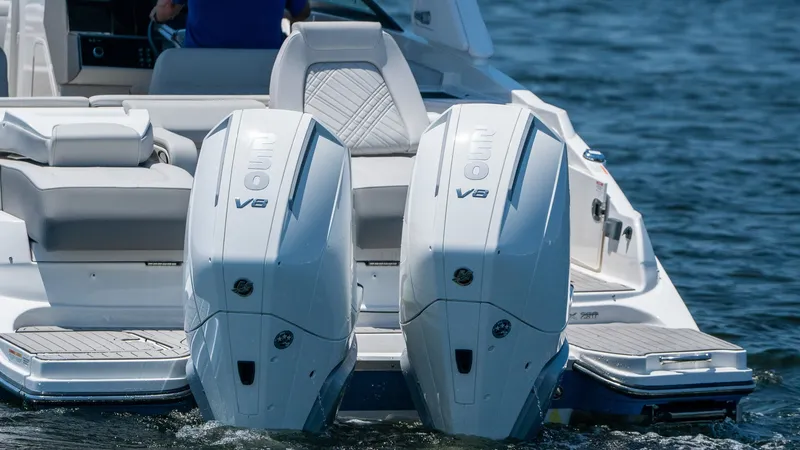 Slide: The Image of Sea Ray SDX 290 Outboard 2026 with twin V8 engines on water. - 12