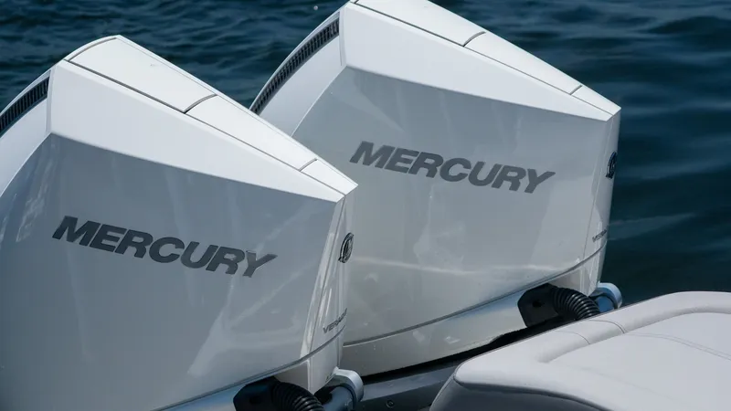 Slide: The Image of Two Mercury outboard engines on a Sea Ray SDX 290 boat. - 18