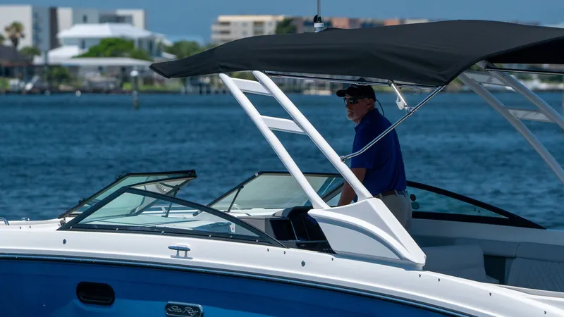 Slide: The Image of 2026 Sea Ray SDX 290 Outboard on water with driver. - 8