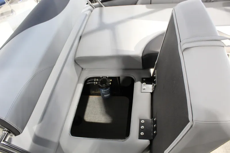Slide: The Image of 2025 Avalon 1985 25 LSZ CRB boat seat storage compartment with open lid. - 10
