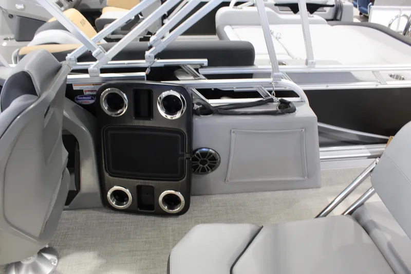 Slide: The Image of Interior of 2025 Avalon 1985 25 LSZ CRB boat with seating and cup holders. - 6