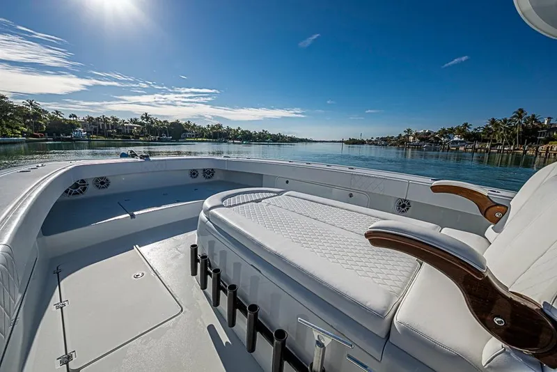 Slide: The Image of Luxurious 2023 Freeman 47 boat interior with plush seating and scenic waterfront view. - 24