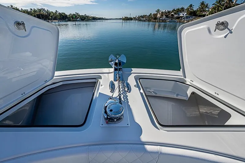 Slide: The Image of Bow view of 2023 Freeman 47 boat with open storage compartments and anchor chain. - 29