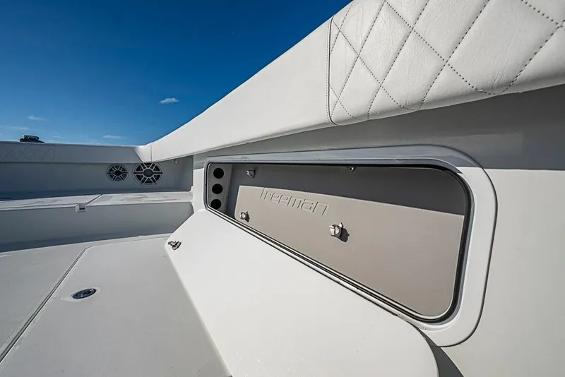 Slide: The Image of 2023 Freeman 47 boat interior with sleek white design and storage compartment. - 35