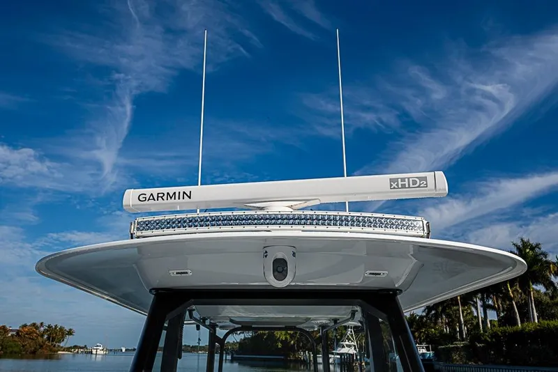 Slide: The Image of 2023 Freeman 47 boat with Garmin xHD2 radar under clear blue sky. - 37