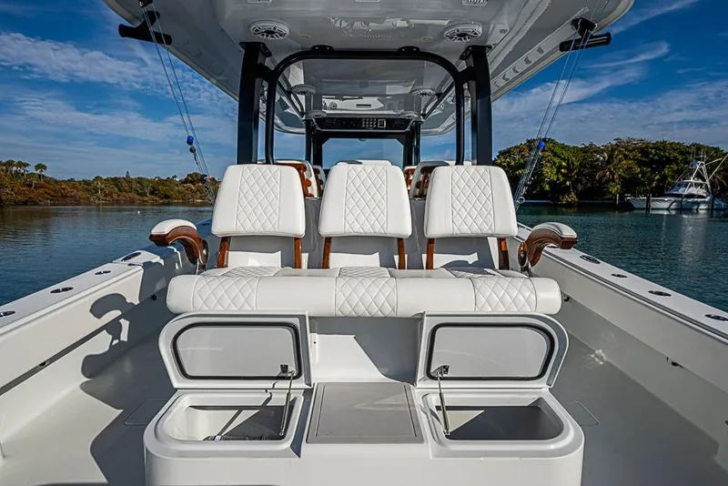 Slide: The Image of 2023 Freeman 47 boat interior with luxurious seating and storage compartments. - 47
