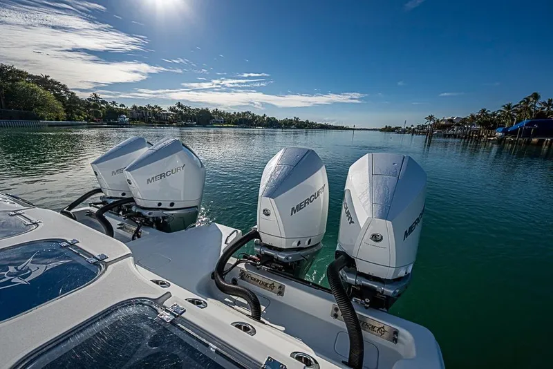 Slide: The Image of 2023 Freeman 47 boat with Mercury engines on a sunny day by the water. - 50