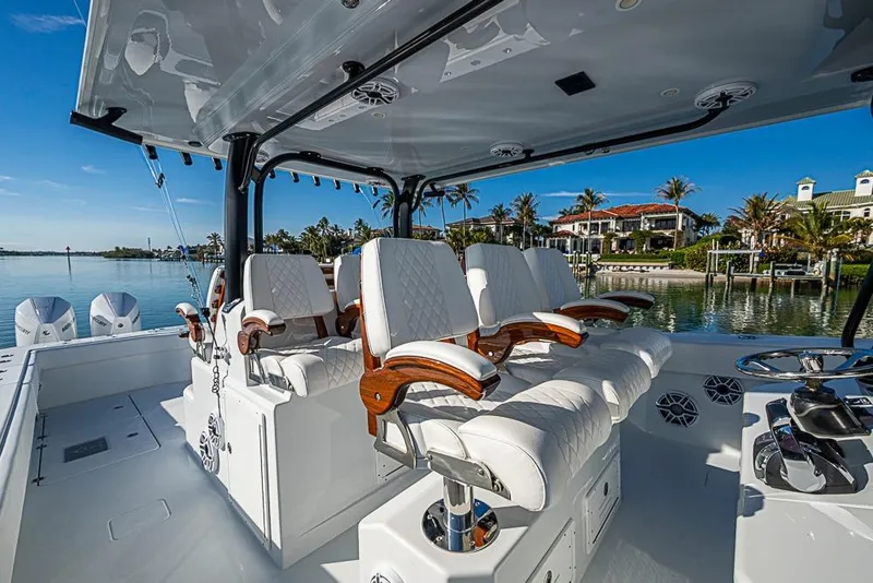 Slide: The Image of Luxury seating on 2023 Freeman 47 boat, with scenic waterfront view. - 55