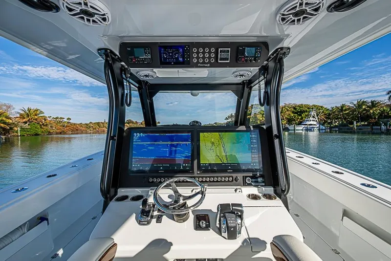 Slide: The Image of Interior view of 2023 Freeman 47 boat cockpit with advanced navigation systems. - 56
