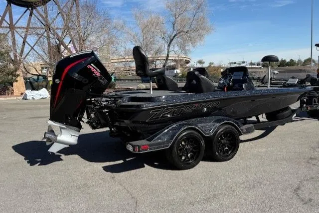 Slide: The Image of 2026 Nitro Z20 XL Pro boat with powerful outboard motor, parked on pavement. - 2