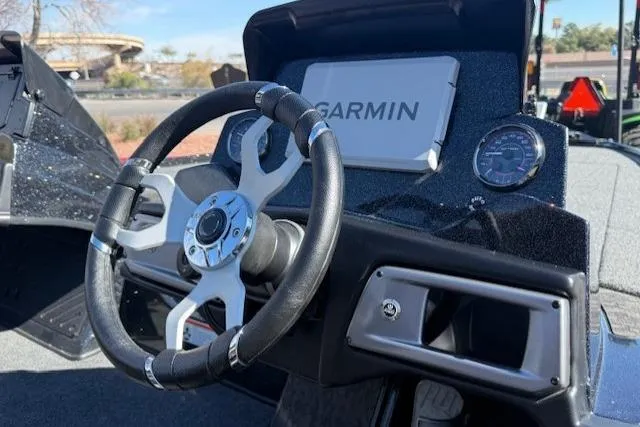 Slide: The Image of Steering wheel and dashboard of 2026 Nitro Z20 XL Pro boat with Garmin display. - 7