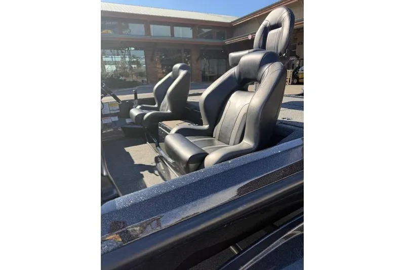Slide: The Image of 2026 Nitro Z20 XL Pro boat seats, black leather, outdoor setting. - 9